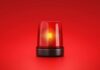 Red emergency light on red background