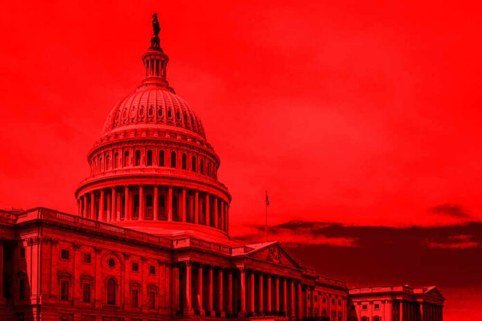 shutterstock_1142146865.jpg featured image United States Capitol building under red-tinted sky.