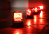 Red emergency lights on a dark floor