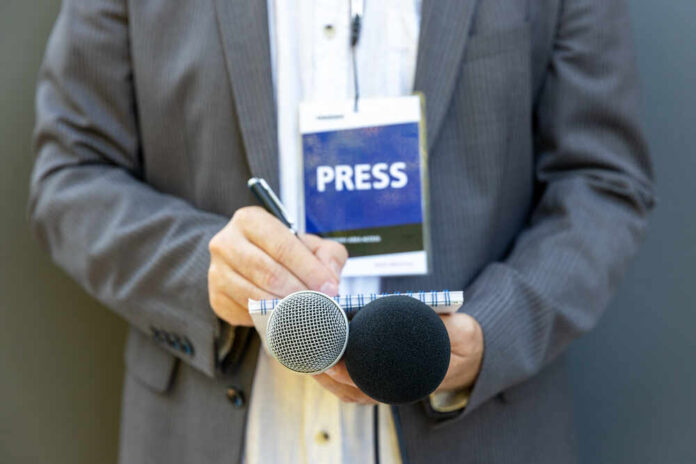 shutterstock_1808083621.jpg featured image Journalist with press badge.