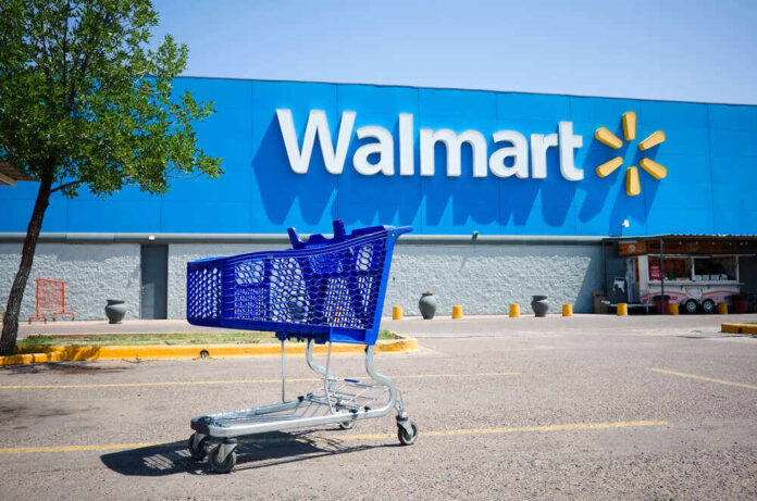 shutterstock_1871096929.jpg featured image Shopping cart in a Walmart parking lot.