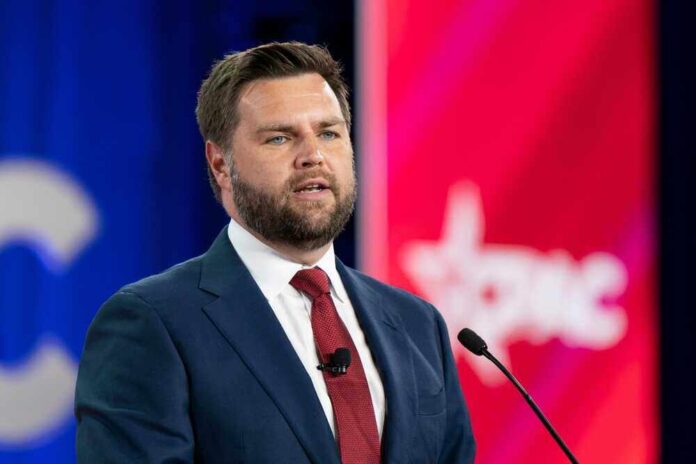 shutterstock_2186937099.jpg featured image JD Vance man at speaking event.