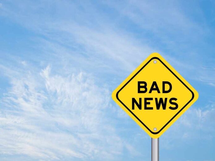 shutterstock_2265927471.jpg featured image Yellow sign reads bad news in sky