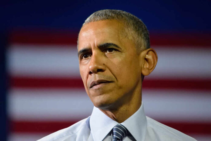 shutterstock_449433211.jpg featured image Barack Obama in front of flag.