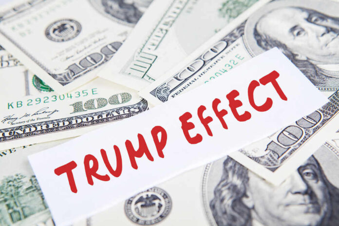 shutterstock_519205120.jpg featured image Text Trump Effect over hundred dollar bills