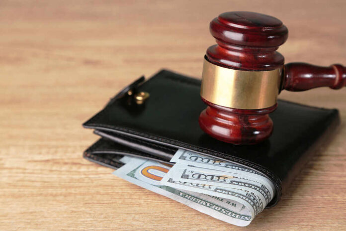shutterstock_195469847.jpg featured image Gavel on wallet with visible dollar bills