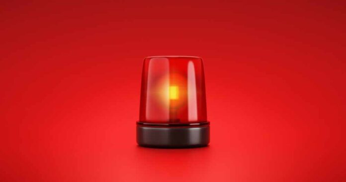 Red emergency light on red background