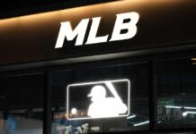 Illuminated MLB sign above storefront window
