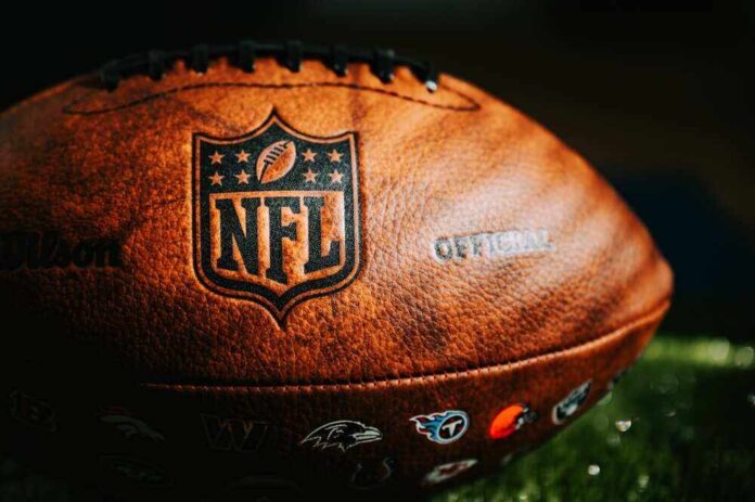 shutterstock_2360713367.jpg featured image Close-up of an NFL football on grass.