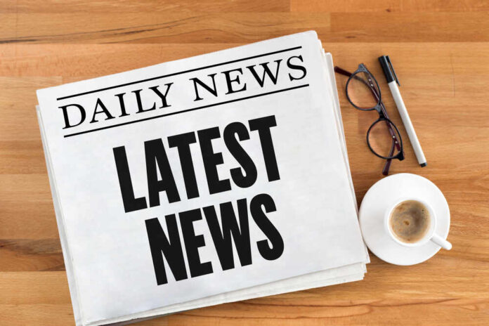 shutterstock_565653796.jpg featured image Newspaper with headline latest news on table