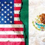 Split American and Mexican flags side by side.