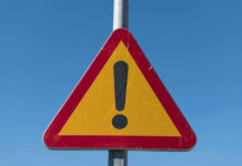 Triangular warning sign with exclamation mark