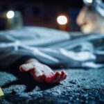 CONGRESSIONAL INTERN KILLED in D.C. SHOOTING Crime scene with covered body and hand exposed.