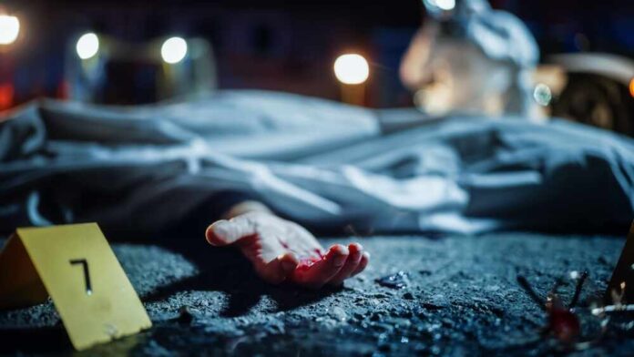 shutterstock_2230645915.jpg featured image Crime scene with covered body and hand exposed.