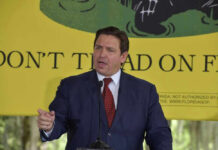 Ron DeSantis speaking at a podium