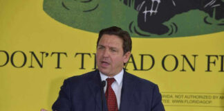 Ron DeSantis speaking at a podium