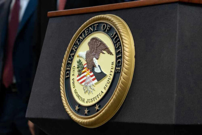 shutterstock_2290672573.jpg Department of Justice seal on a podium
