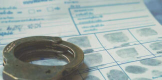 Handcuffs on a fingerprint document