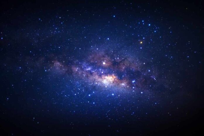 Starry night sky with bright Milky Way galaxy