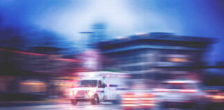 Ambulance speeding through city street