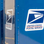 Latest USPS Decision ANGERS Americans Row of blue United States Postal Service mailboxes