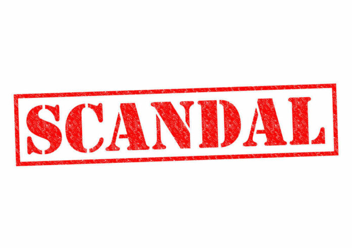 Red stamp with the word scandal
