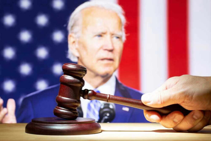 Joe Biden with a hand holding a gavel