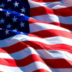 Volunteer Patriots Stun Leftist Immigration Critics USA flag waving in the wind