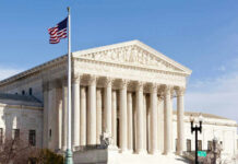US Supreme Court building with American flag