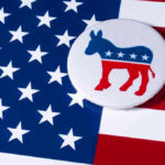 Democratic donkey button on American flag background