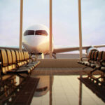 Airplane viewed from an empty airport waiting area