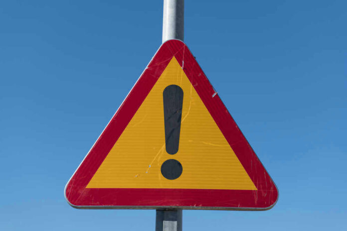 Triangular warning sign with exclamation mark