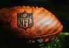 Close-up of an NFL football on grass