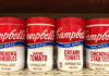 Various Campbell's soup containers on a grocery shelf