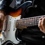 Close-up of a musician playing an electric guitar