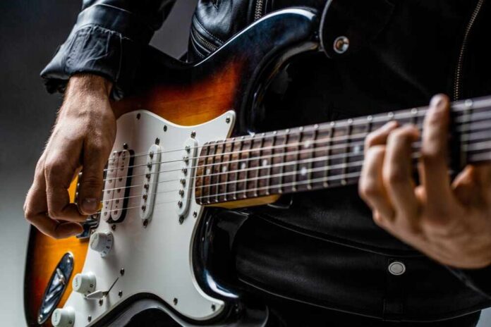 Close-up of a musician playing an electric guitar