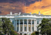 The White House with vibrant sunset sky.