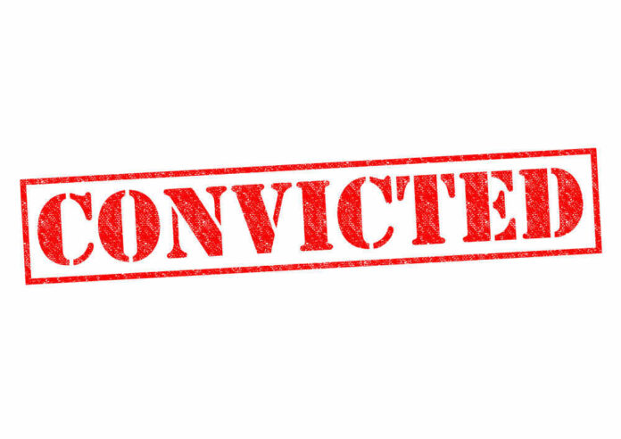 Red stamped text convicted on white background