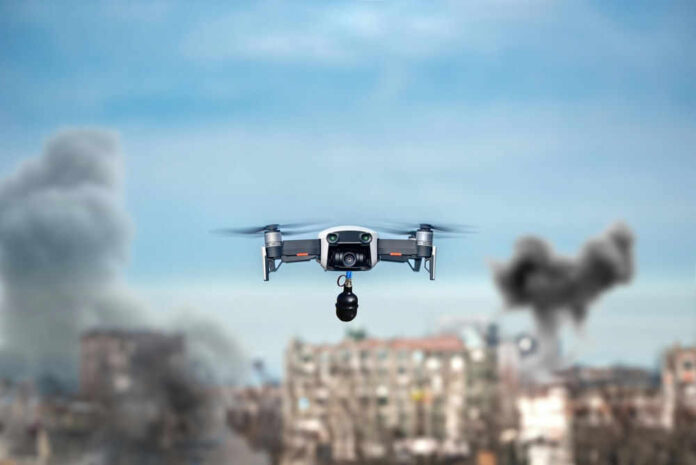 Drone flying over urban area with smoke plumes.