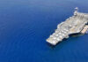 Aircraft carrier on a vast blue ocean