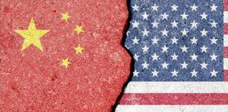 Cracked surface revealing the flags of China and the USA
