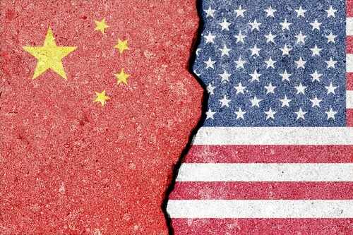 Cracked surface revealing the flags of China and the USA