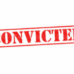Red stamped text convicted on white background