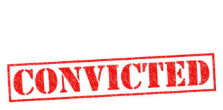 Red stamped text convicted on white background