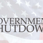 Text 'GOVERNMENT SHUTDOWN' overlaid on an American flag background
