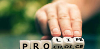 Hand shifting blocks spelling pro life to pro choice