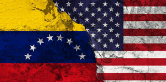 Cracked Venezuela and USA flags side by side