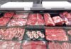 Variety of fresh meats displayed in a butcher shop