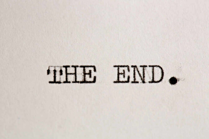 Typewritten text reading 'THE END.' on a sheet of paper