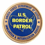 U.S. Border Patrol emblem with Department of Justice insignia.